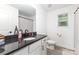 Tastefully designed bathroom features a stylish vanity with granite counters at 409 Woodcrest Ln, Albemarle, NC 28001