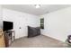 Bright bedroom features plush beanbag chair and neutral carpet flooring at 409 Woodcrest Ln, Albemarle, NC 28001