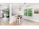 Charming dining area with a rustic-style table and lots of natural light at 409 Woodcrest Ln, Albemarle, NC 28001