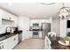 Spacious kitchen boasts stainless appliances, black counters and white cabinetry at 409 Woodcrest Ln, Albemarle, NC 28001
