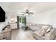 Cozy living room with bright, natural light and a large comfortable sectional at 409 Woodcrest Ln, Albemarle, NC 28001