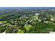 Expansive aerial view of a home nestled on a large lot with mature trees and a serene lake nearby at 426 Walden Trl, Waxhaw, NC 28173