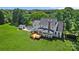 Aerial view of large home with deck, shed, and expansive green lawn at 426 Walden Trl, Waxhaw, NC 28173