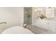 Bright bathroom featuring a soaking tub and a frameless glass shower at 426 Walden Trl, Waxhaw, NC 28173