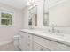 A well-lit bathroom featuring double sinks and modern fixtures at 426 Walden Trl, Waxhaw, NC 28173
