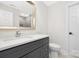 Bathroom featuring marble countertops, gray cabinetry, and modern fixtures at 426 Walden Trl, Waxhaw, NC 28173