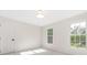 Well-lit bedroom with white walls and two large windows for natural light at 426 Walden Trl, Waxhaw, NC 28173