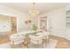 Elegant dining room showcasing a glass table with modern chairs and a stylish chandelier at 426 Walden Trl, Waxhaw, NC 28173