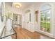 Lovely foyer with hardwood floors, arched doorway, and a view of the front lawn at 426 Walden Trl, Waxhaw, NC 28173