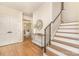 Inviting foyer with hardwood floors, stairs, and views into other living spaces at 426 Walden Trl, Waxhaw, NC 28173