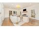 Bright living room with hardwood floors, fireplace, comfortable seating, and stylish decor at 426 Walden Trl, Waxhaw, NC 28173