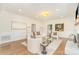 Inviting living room features hardwood floors, fireplace, neutral decor, and ample natural light at 426 Walden Trl, Waxhaw, NC 28173