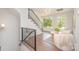 Inviting living space featuring staircase, hardwood floors, and natural lighting at 426 Walden Trl, Waxhaw, NC 28173