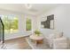 Cozy living space featuring hardwood floors, neutral furniture, and natural lighting at 426 Walden Trl, Waxhaw, NC 28173