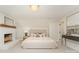 Stylishly furnished main bedroom with a cozy fireplace and a decorative chandelier at 426 Walden Trl, Waxhaw, NC 28173