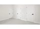 A bright room featuring white walls, base trim, and black hardware at 426 Walden Trl, Waxhaw, NC 28173