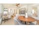 Cozy sunroom with brick floors, a ceiling fan, and stylish neutral furniture at 426 Walden Trl, Waxhaw, NC 28173