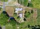 Aerial view of the property, showcasing various outbuildings, greenery and ample parking at 4734 Polk Ford Rd, Stanfield, NC 28163