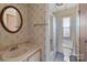 Small bathroom with floral wallpaper, tub and shower at 4734 Polk Ford Rd, Stanfield, NC 28163