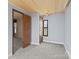 Empty bedroom with small window and gray walls at 4734 Polk Ford Rd, Stanfield, NC 28163