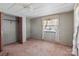 This bedroom features carpet flooring, a double door closet and natural light from the window at 4734 Polk Ford Rd, Stanfield, NC 28163