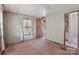 This bedroom features carpet flooring, a window that brings in natural light and access to the bathroom at 4734 Polk Ford Rd, Stanfield, NC 28163
