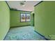 A green bedroom with a window overlooking the yard and a closet for storage, needs some TLC at 4734 Polk Ford Rd, Stanfield, NC 28163