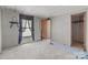 Empty bedroom with outdated walls and flooring at 4734 Polk Ford Rd, Stanfield, NC 28163
