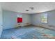 This bedroom features two windows for natural light and carpeted flooring, needs some TLC at 4734 Polk Ford Rd, Stanfield, NC 28163