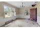 Dining room with wallpaper, chandelier, and view to backyard at 4734 Polk Ford Rd, Stanfield, NC 28163