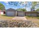 This home features multiple garages with white doors, concrete pads and grass at 4734 Polk Ford Rd, Stanfield, NC 28163