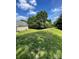 Large, well-maintained backyard with lush green grass and privacy provided by mature trees at 5012 Wheat Sw Dr, Concord, NC 28027