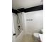 Clean bathroom showcasing white tub, modern hardware, and neutral tiling at 5012 Wheat Sw Dr, Concord, NC 28027