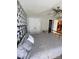 Neutral bedroom boasts unique wall design, large closet, and a comfortable bed at 5012 Wheat Sw Dr, Concord, NC 28027