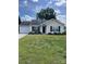 Charming single-story home featuring a manicured lawn and attached garage, perfect for first-time buyers at 5012 Wheat Sw Dr, Concord, NC 28027