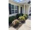 Close-up of a well-maintained entrance with beautiful flowering bushes, offering great curb appeal at 5012 Wheat Sw Dr, Concord, NC 28027