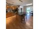Well-equipped kitchen featuring stainless steel appliances, an island with seating, and stylish backsplash detailing at 5012 Wheat Sw Dr, Concord, NC 28027