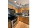 Modern kitchen with stainless steel appliances, a stylish backsplash, and an updated lighting fixture at 5012 Wheat Sw Dr, Concord, NC 28027