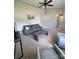 Bright living room featuring plush carpeting, neutral colors, and a contemporary ceiling fan for added comfort at 5012 Wheat Sw Dr, Concord, NC 28027
