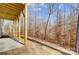Spacious backyard with a covered deck attached to a home bordering a wooded area at 5027 Mclaughlin Loop # 61, Waxhaw, NC 28173
