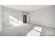 Spacious bedroom with neutral carpet, double door closet and abundant natural light at 5027 Mclaughlin Loop # 61, Waxhaw, NC 28173
