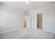 Neutral bedroom with gray carpet and doors to bathroom and closet at 5027 Mclaughlin Loop # 61, Waxhaw, NC 28173