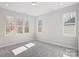 Bright bedroom featuring neutral colors, plush carpet, and natural light at 5027 Mclaughlin Loop # 61, Waxhaw, NC 28173