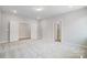 Bright bedroom with neutral paint, plush gray carpet and walk-in closet at 5027 Mclaughlin Loop # 61, Waxhaw, NC 28173