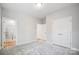 Bright bedroom with a walk-in closet and ensuite bathroom featuring modern finishes at 5027 Mclaughlin Loop # 61, Waxhaw, NC 28173