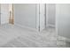 Neutral bedroom with gray carpet, white trim, walk-in closet, and natural light at 5027 Mclaughlin Loop # 61, Waxhaw, NC 28173
