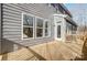 Wood deck on gray home offers outdoor living space with views at 5027 Mclaughlin Loop # 61, Waxhaw, NC 28173