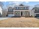Beautiful two-story home with a two car garage and manicured front lawn at 5027 Mclaughlin Loop # 61, Waxhaw, NC 28173