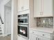 Modern kitchen features stainless steel appliances, granite countertops and white cabinets at 5027 Mclaughlin Loop # 61, Waxhaw, NC 28173
