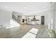 Open floor plan with a modern kitchen, staircase, and light-filled living spaces at 5027 Mclaughlin Loop # 61, Waxhaw, NC 28173